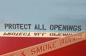 IBC 2009 requires the marking and identification of fire and smoke barriers to ensure penetrations are protected.